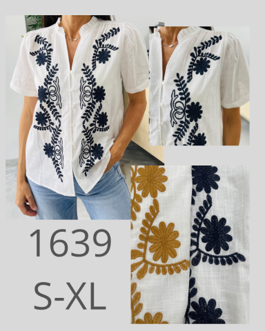 Camisa blanca con bordado en negro y dorado, disponible en tallas S-XL.
