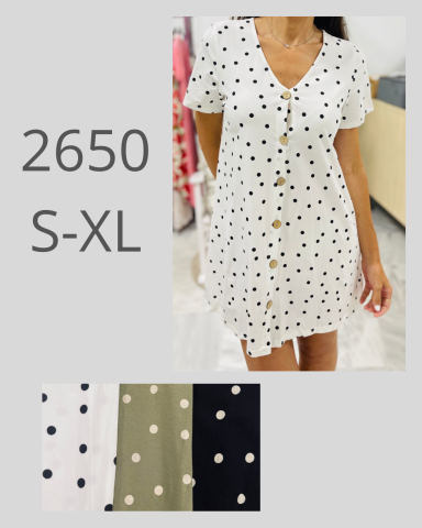 Vestido blanco con puntos negros y botones, disponible en tallas S-XL.