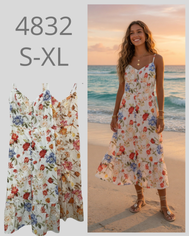 Vestido largo floral con tirantes, usado por una mujer en una playa al atardecer.