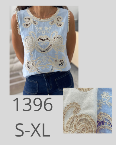 Blusa sin mangas azul con bordados en tonos crema y detalles decorativos. Tallas S-XL.