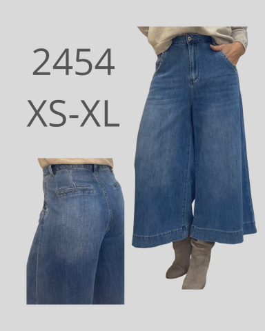 Pantalones de mezclilla amplios en color azul, disponibles en tallas XS a XL.