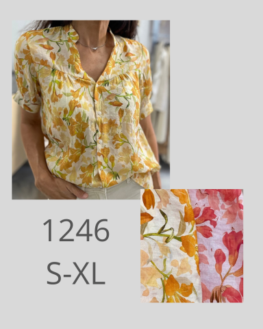 Camisa floral en tonos amarillos y naranjas, disponible en tallas S-XL.