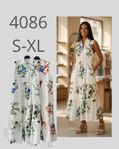 Vestido largo blanco con flores, disponible en tallas S-XL. Modelo lo lleva puesto.