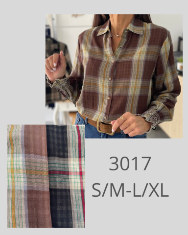 Camisa de cuadros en tonos marrones, rojos y amarillos, con botones y cuello.