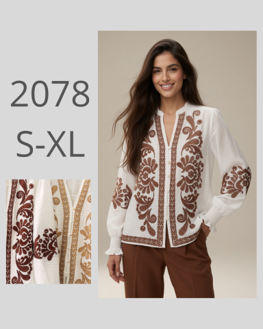 Blusa blanca con bordados en tonos marrón y dorado, disponible en tallas S-XL.