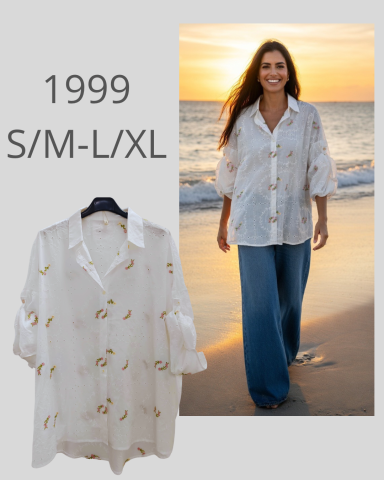 Camisa blanca con estampado, modelada por una mujer en la playa al atardecer.