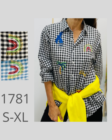 Camisa a cuadros negros y blancos con bordados coloridos y cinturón amarillo. Tallas S-XL.