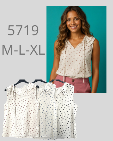 Blusa sin mangas blanca con lunares negros, disponible en tallas M, L y XL.