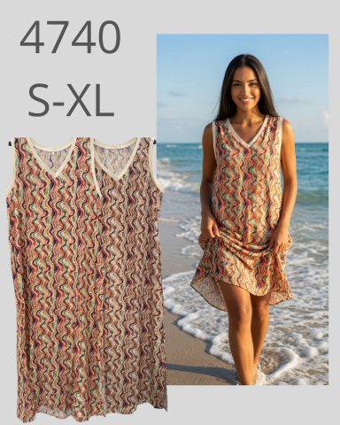 Vestido de verano ligero con diseño de colores, modelo en la playa. Tallas S-XL.