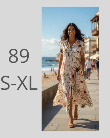 Mujer caminando por la playa con vestido largo de flores, luz brillante y ambiente veraniego.