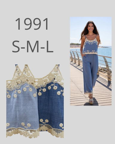 Blusa de tirantes con bordado, disponible en tallas S, M y L. Modelo en la pasarela.