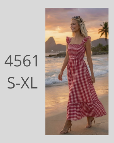 Mujer caminando por la playa al atardecer, luciendo un vestido rojo de tirantes.