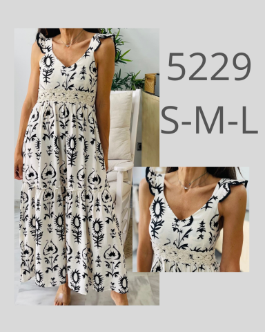 Vestido largo con estampado en blanco y negro, disponible en tallas S, M y L.